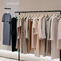 Shirts hanging on rack at retail store