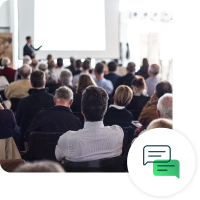 Public speaker in front of audience with conversation icon