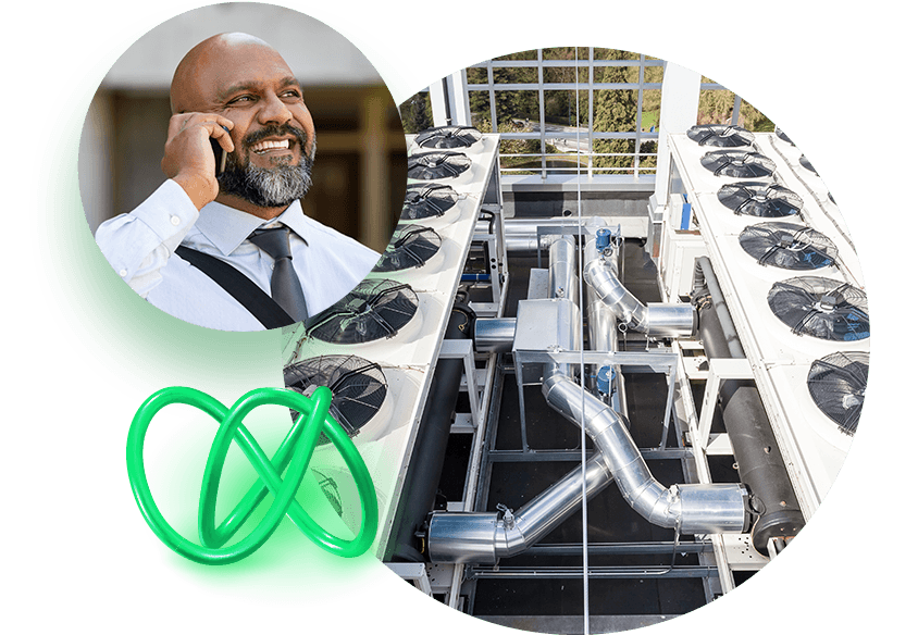 HVAC system on roof and man talking on phone